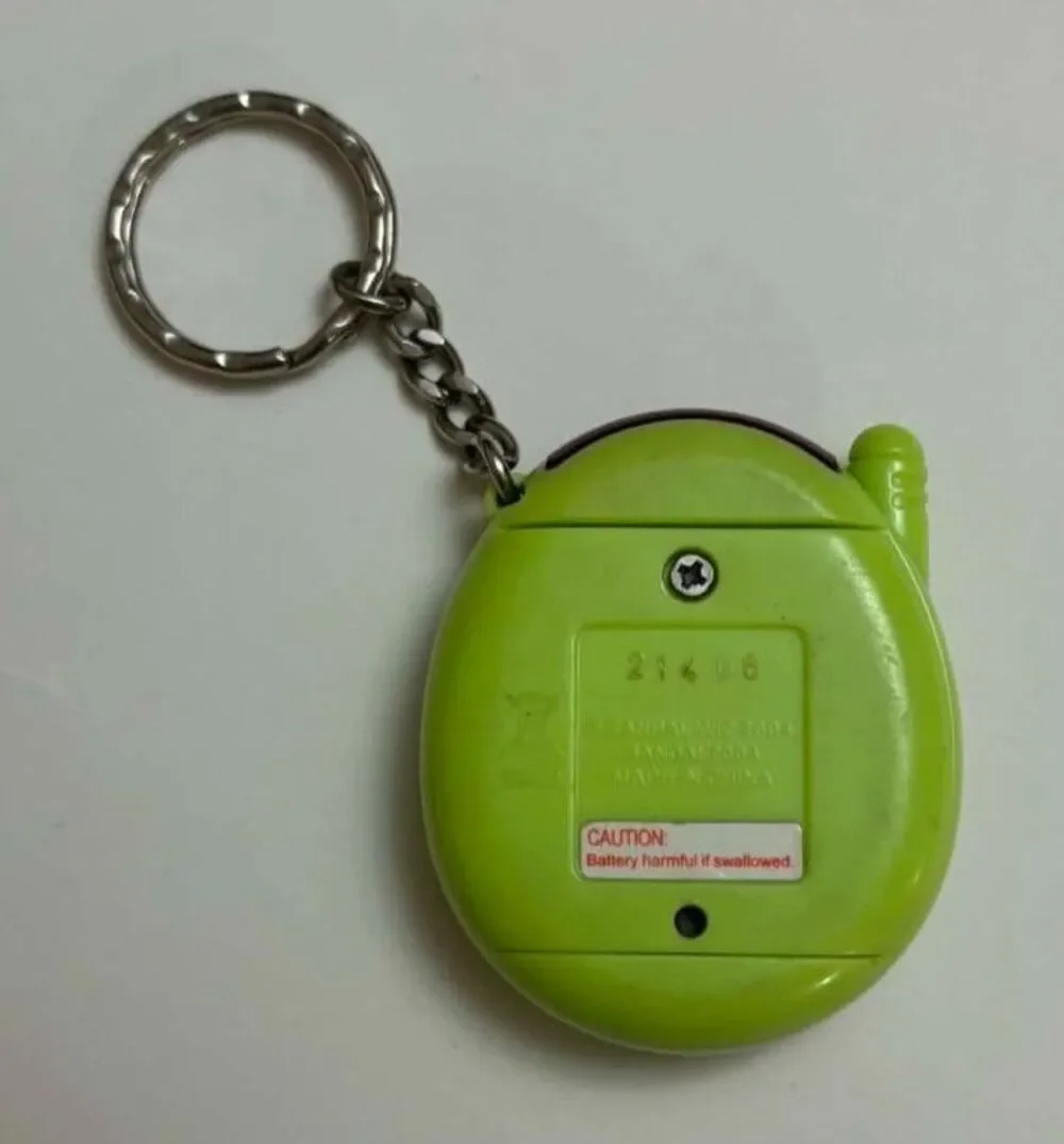 Vintage Tamagotchi Connection V3 Hibiscus Tropical Green TamaTown 2004 Keychain